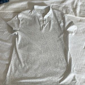 Nike dry-fit women’s polo with short collar. Like new